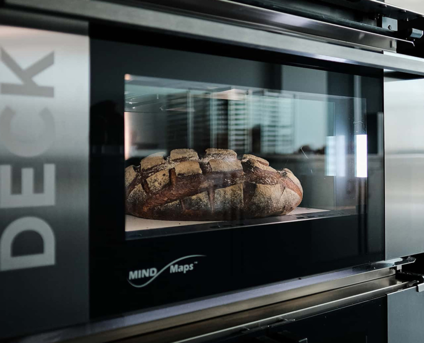 Side view of a loaf of bread in an oven