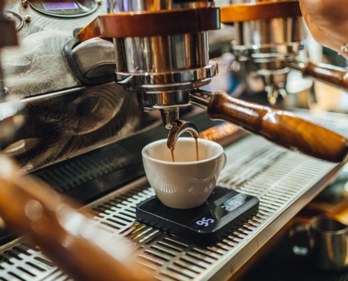 Worker brewing espresso