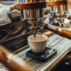 Worker brewing espresso