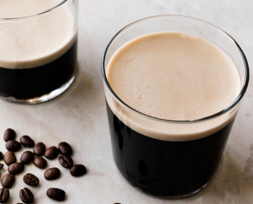 Frothy Cold Brew Nitro Coffee with Beans Ready to Drink.