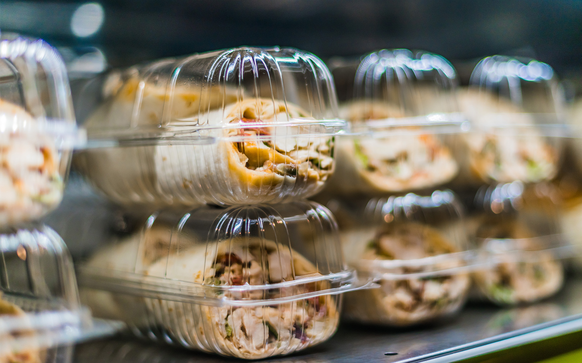 packaged sandwiches displayed in a commercial refrigerator